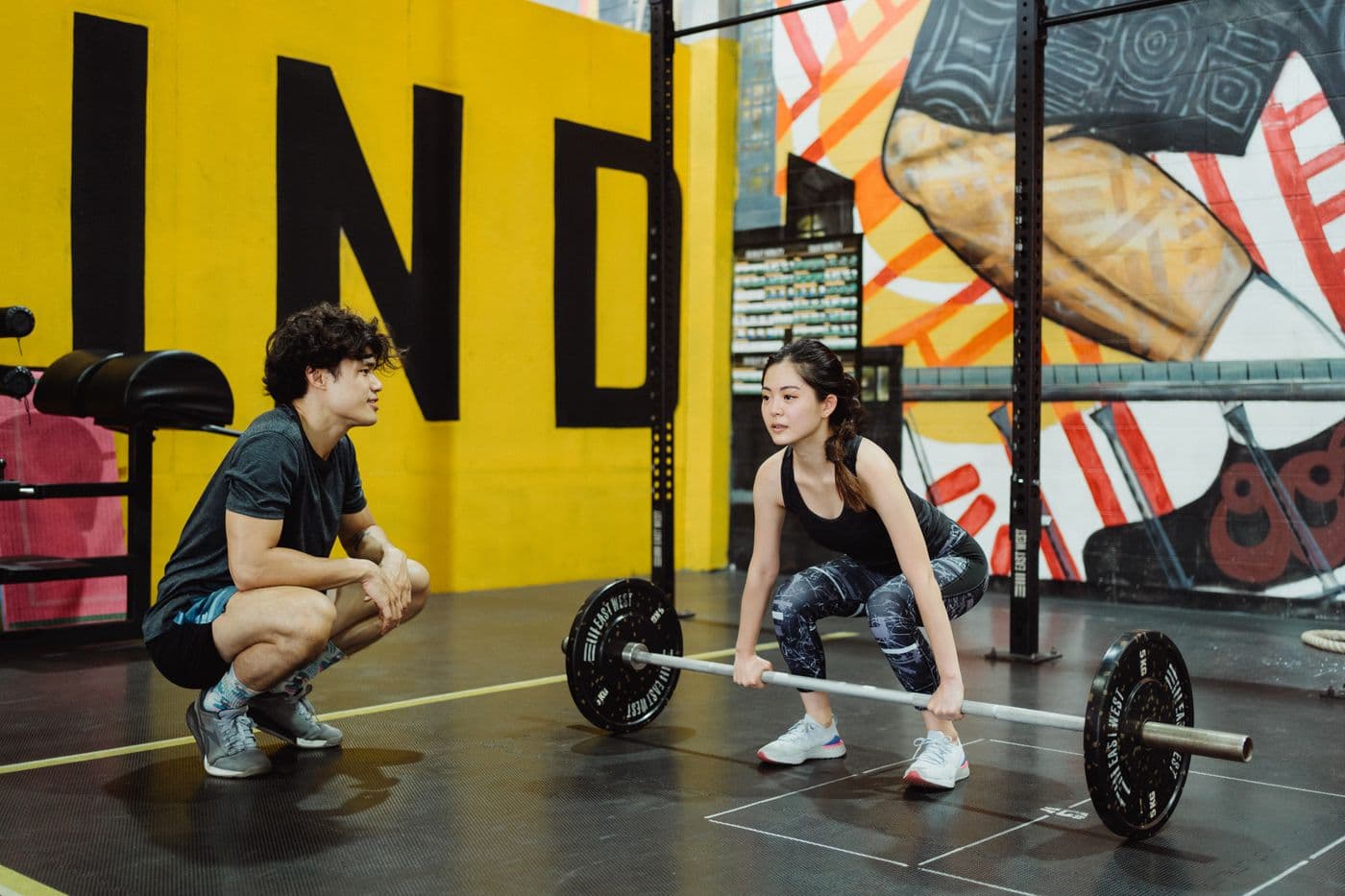 Fitness professional leading a session in a modern training studio